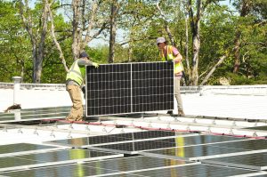 Team Sundance installing solar panels at Hanvey Engineering in Easley, SC